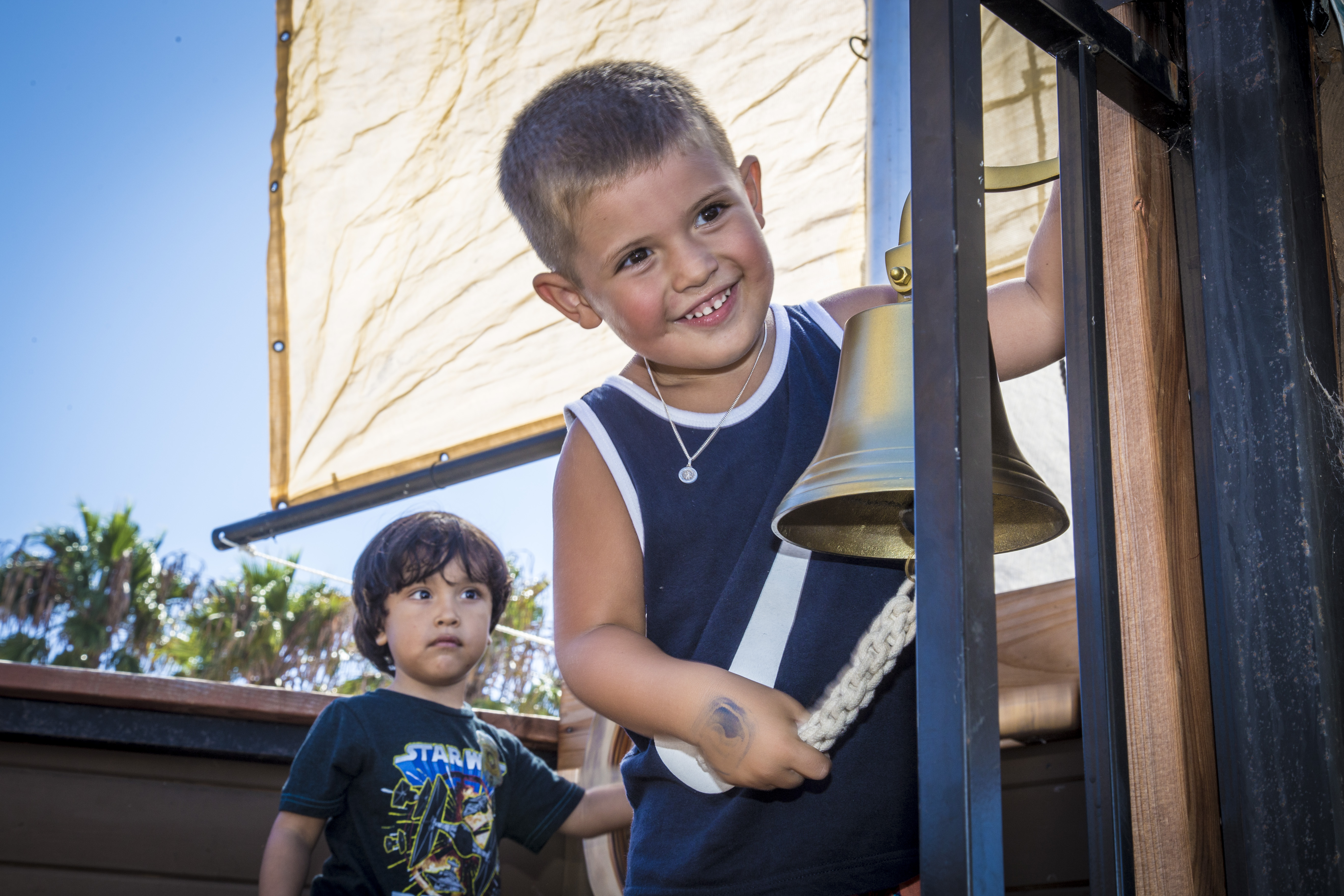Kids on pirate ship ringing bell