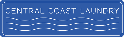 Close-up of Central Coast Laundry sign with blue background and white text.